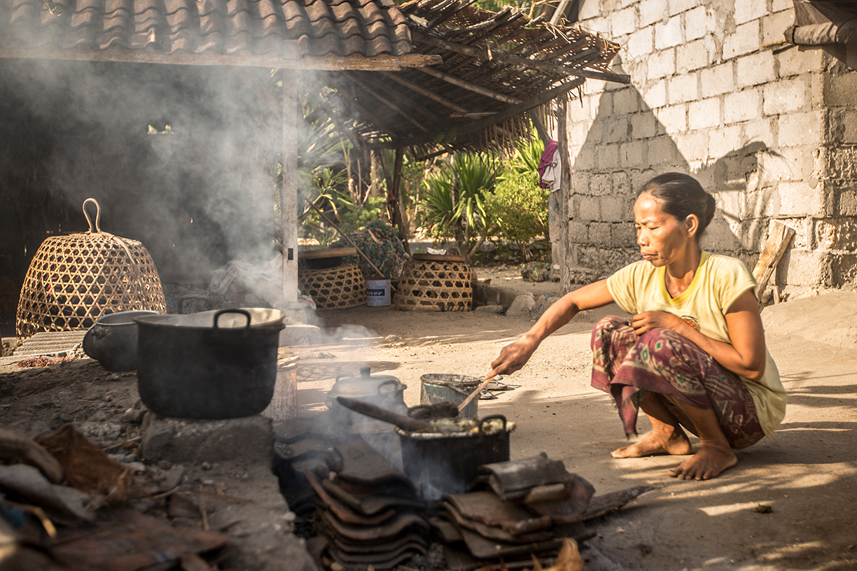 Domestic lifestyle of a Balinese woman doing outdoor cooking